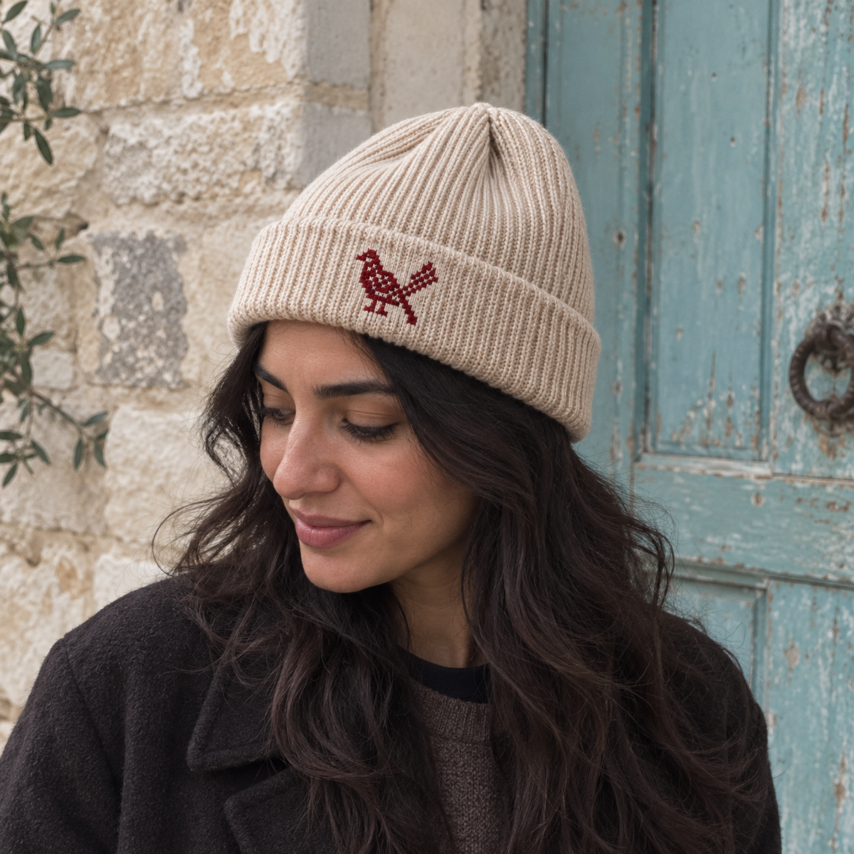 Bird Tatreez Beanie - Oatmeal worn on an adult model
