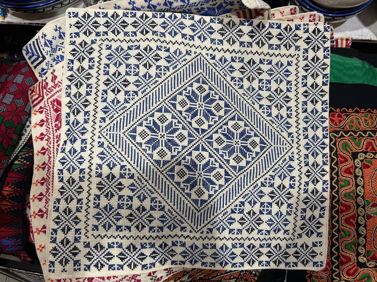 Blue and black floral diamond tatreez cushion cover, original shop photograph