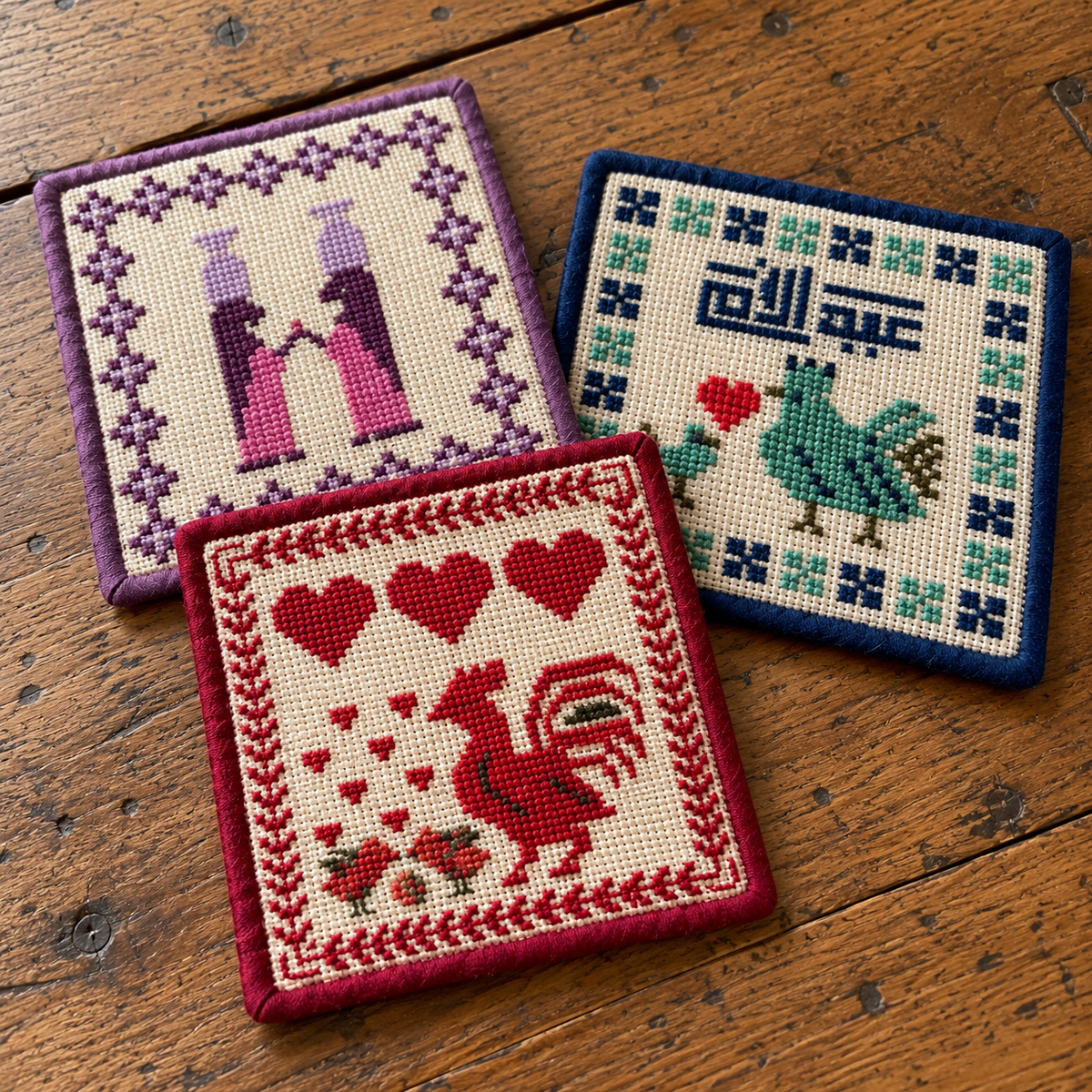Close-up of the three embroidered fabric coasters