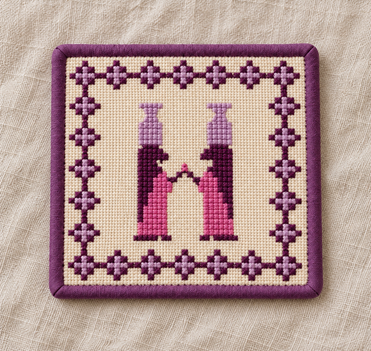 Two women in pink and purple tatreez coaster