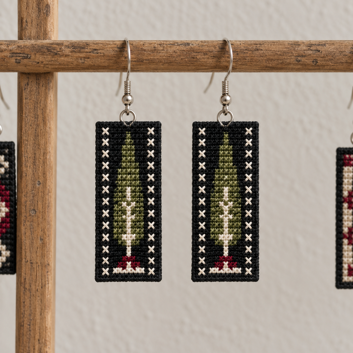 Cypress Tree Tatreez Earrings - Charcoal - pair hanging on display