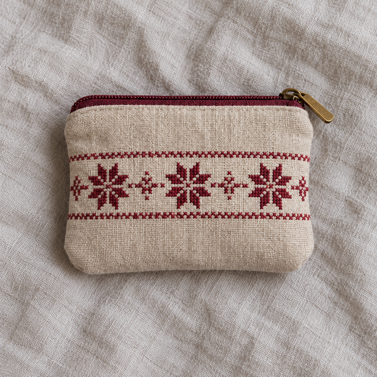 Oatmeal linen coin purse with burgundy star tatreez and a burgundy zip
