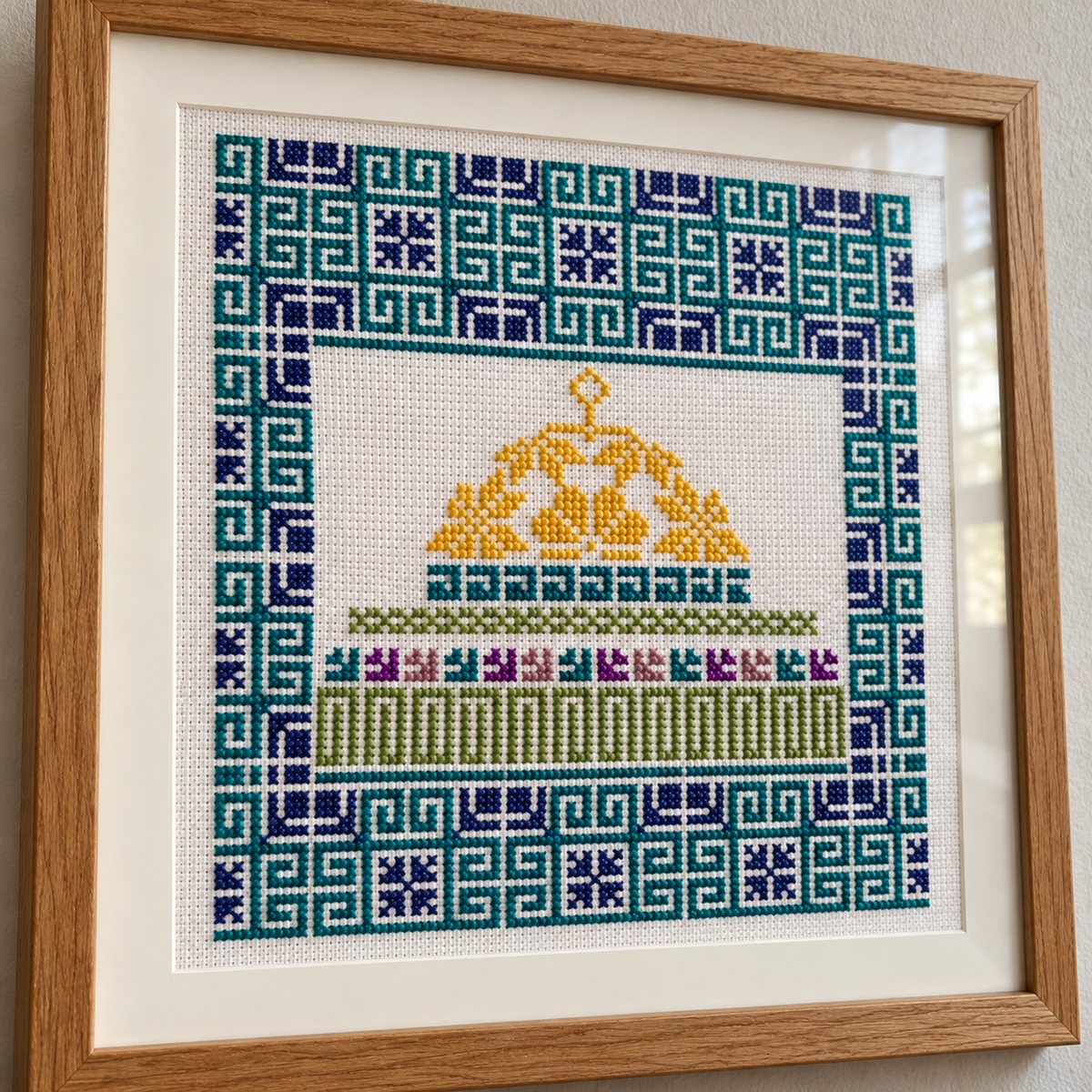 Framed Dome of the Rock tatreez art with a gold dome and teal and navy geometric border - additional product view