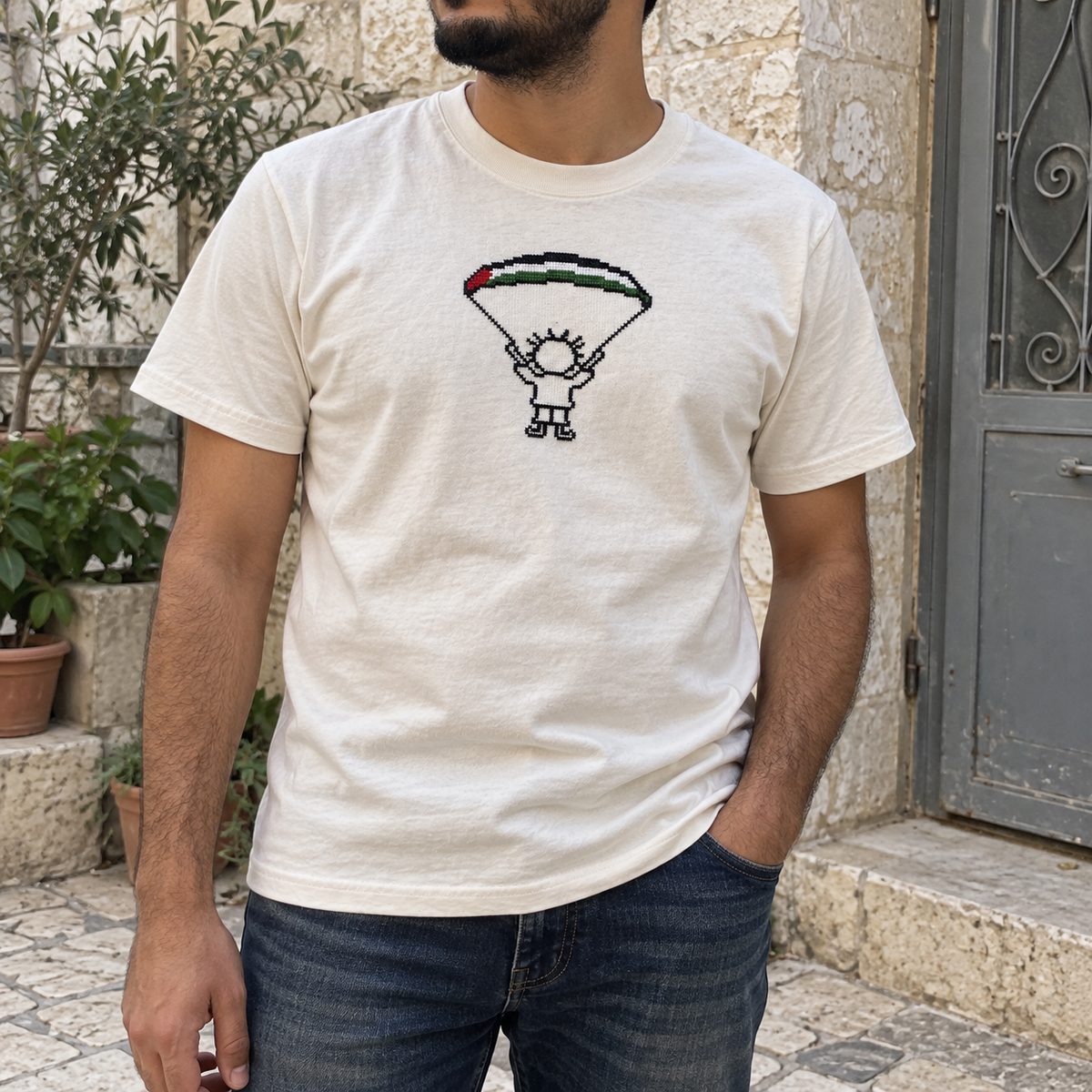 Handala parachute T-shirt worn by a man
