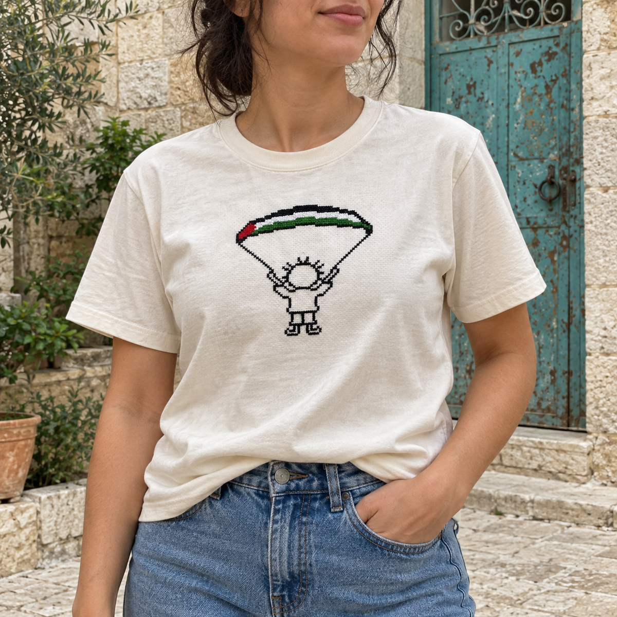 Handala parachute T-shirt worn by a woman