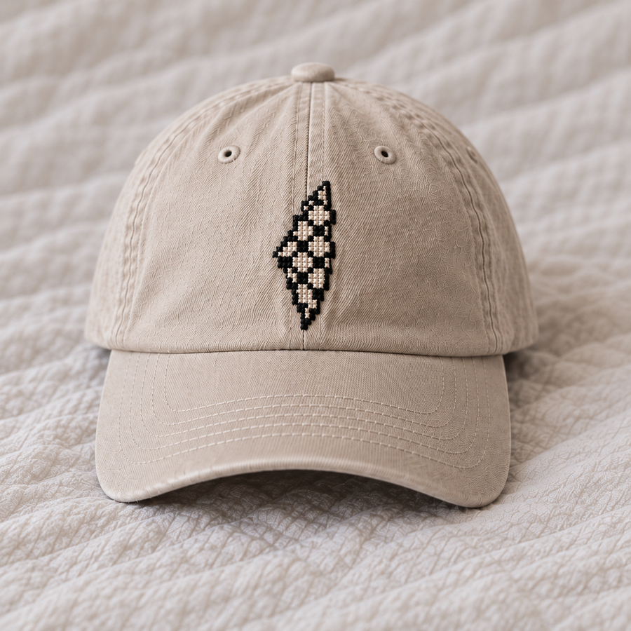 Small black ivory keffiyeh diamond lattice Palestine map, generous blank space between southern tip and brim seam.