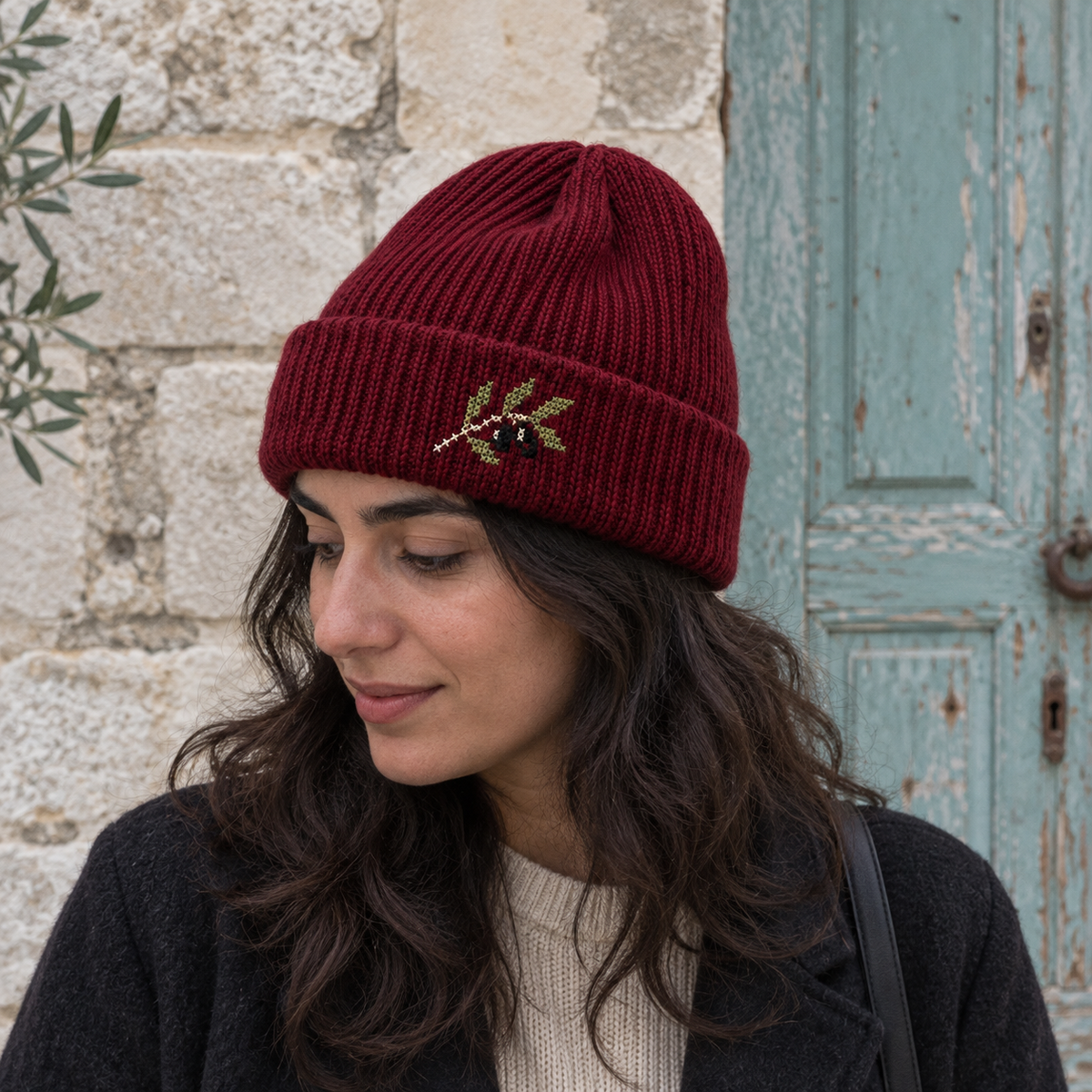 Olive Branch Tatreez Beanie - Burgundy worn on an adult model