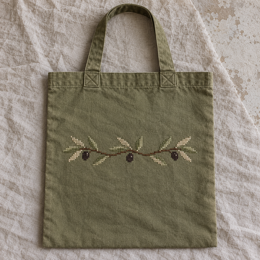 Olive cotton flat tote with a stitched olive branch