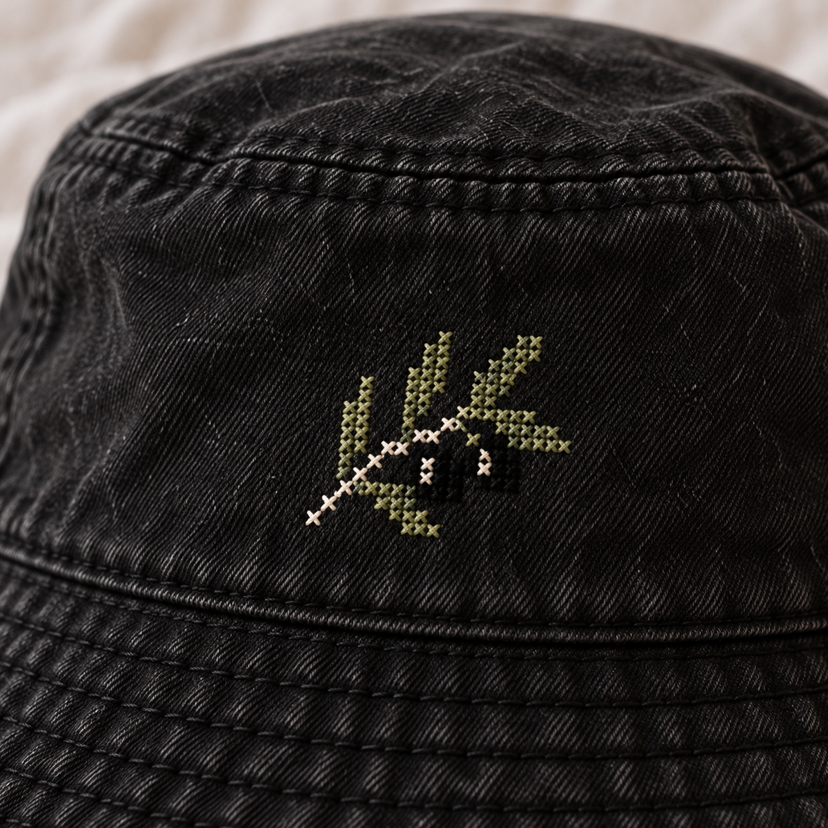 Olive Branch Tatreez Bucket Hat - Black - close-up of Palestinian tatreez stitching