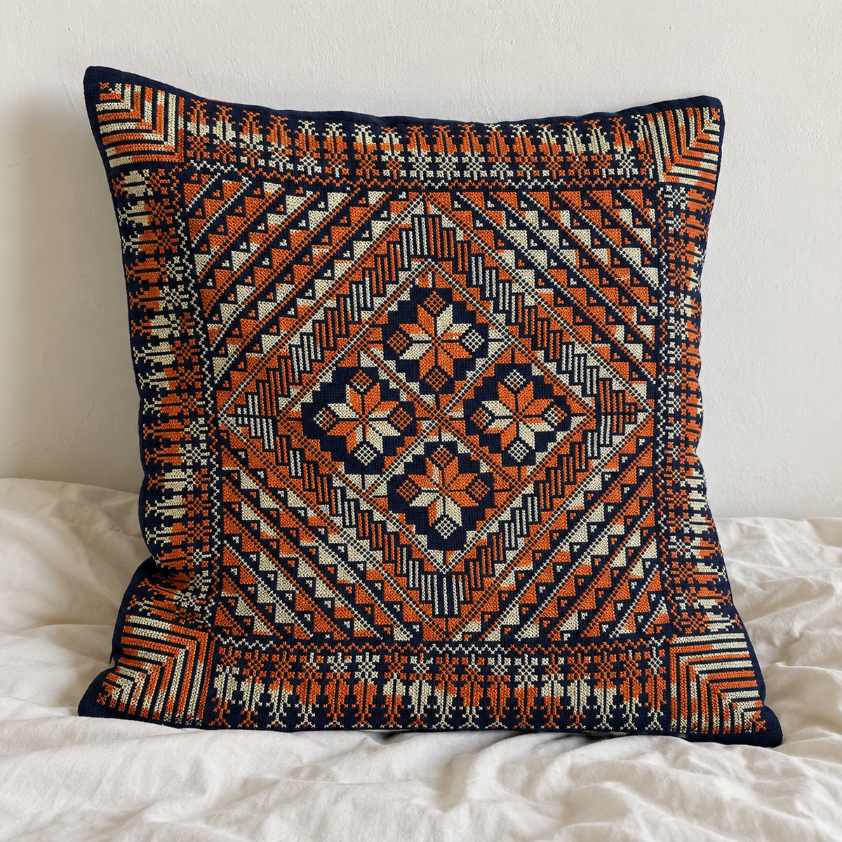 Orange and Ivory Tatreez Cushion Cover - Navy, styled on a cushion insert