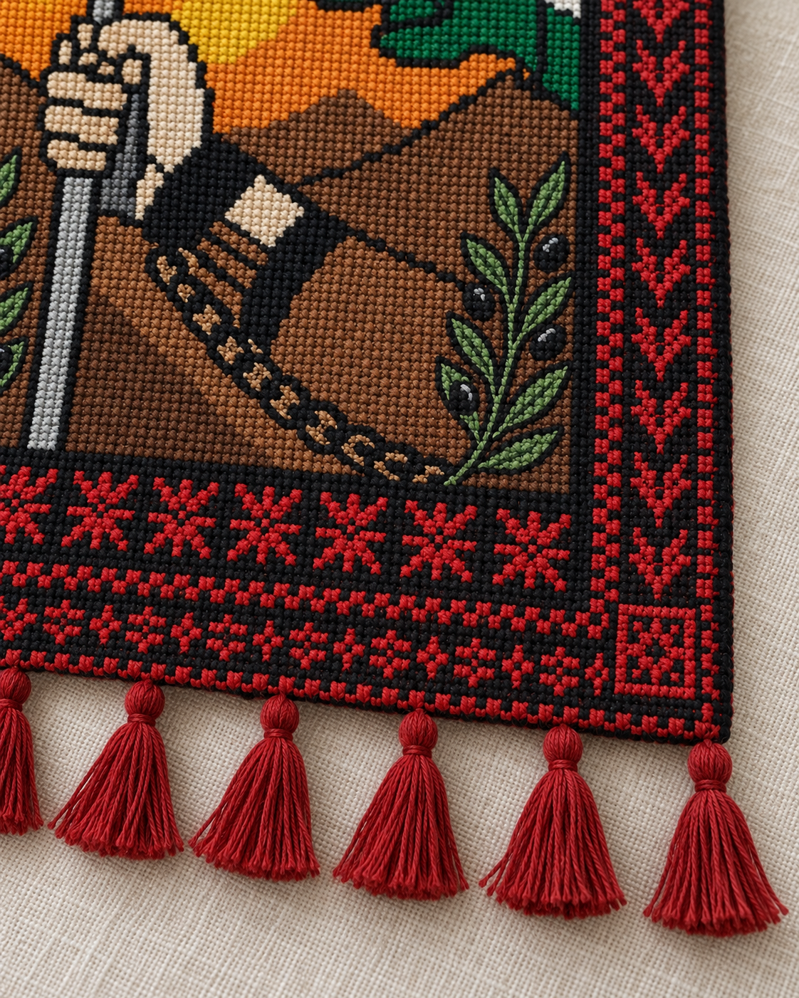 Design preview showing embroidered olive branch, geometric border and tassels