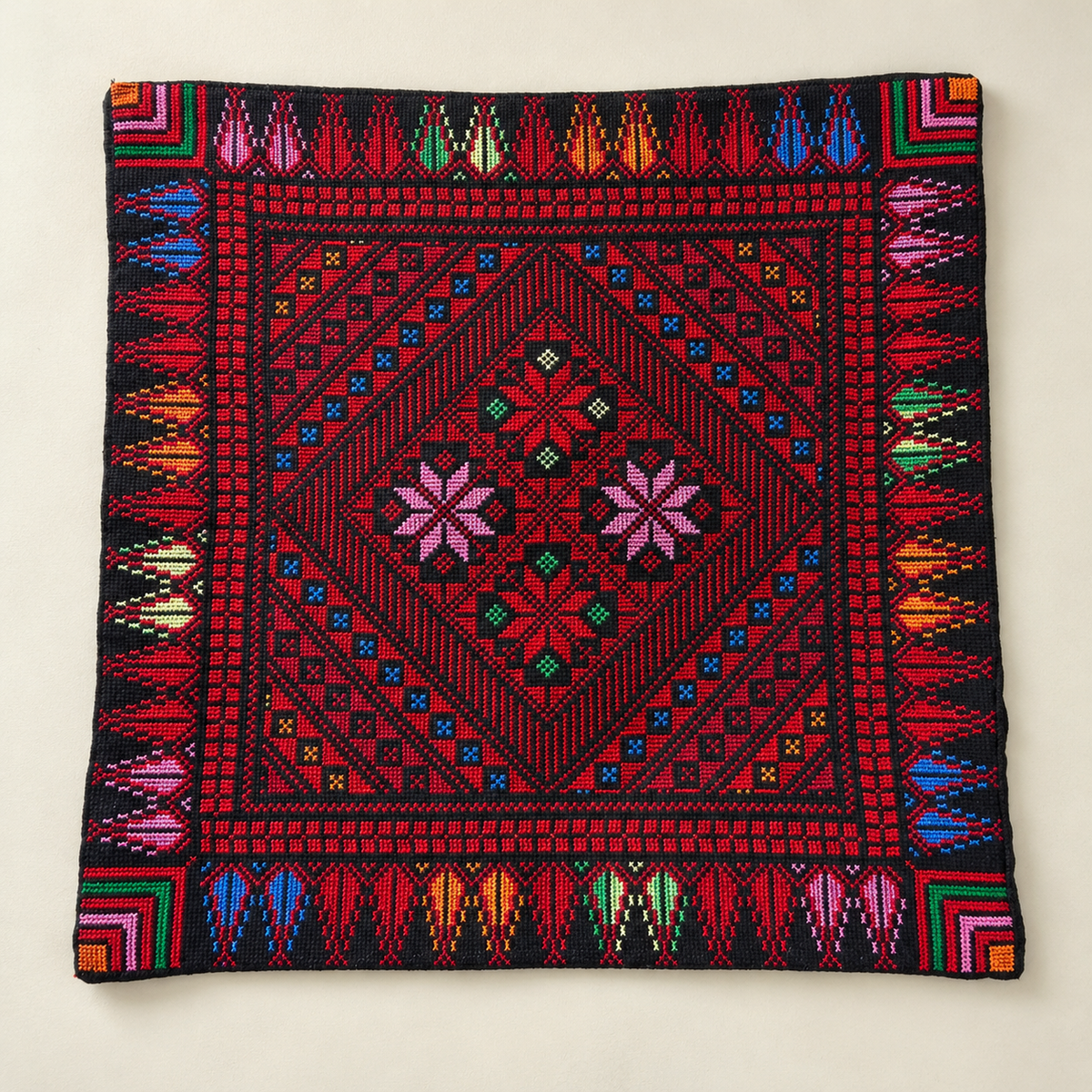 Red Floral Diamond Tatreez Cushion Cover - Black, embroidered front laid flat
