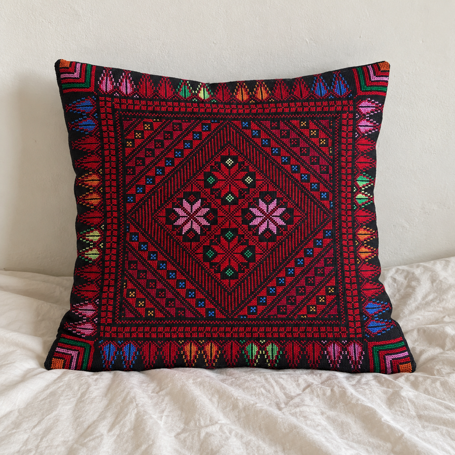 Red Floral Diamond Tatreez Cushion Cover - Black, styled on a cushion insert
