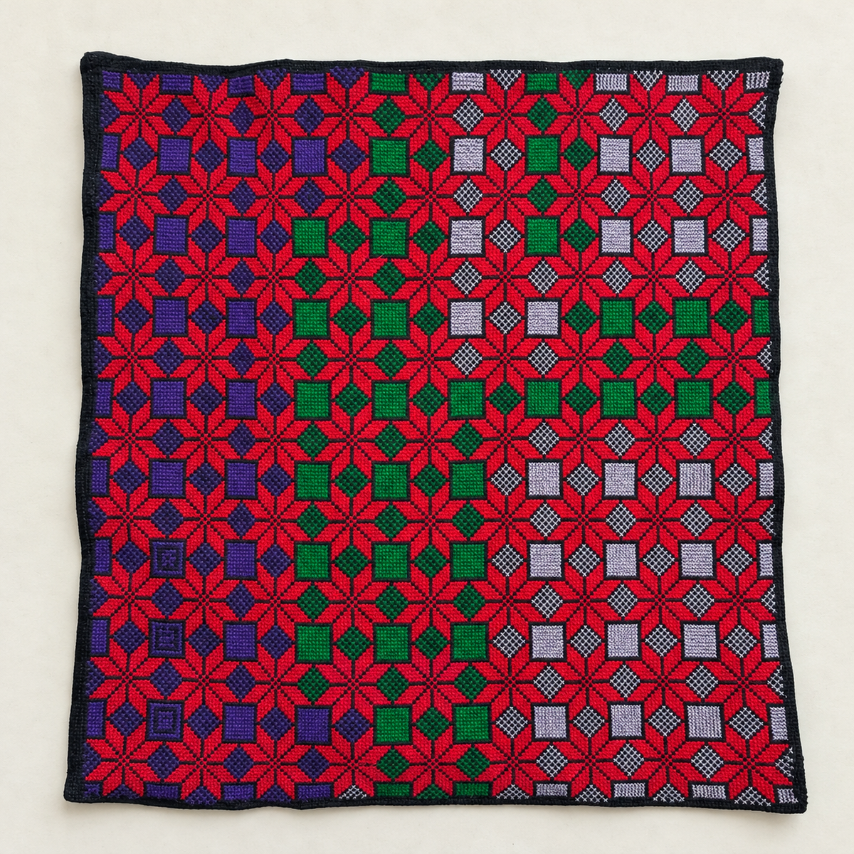 Red Star Lattice Tatreez Cushion Cover - Black, embroidered front laid flat