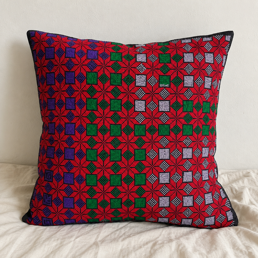 Red Star Lattice Tatreez Cushion Cover - Black, styled on a cushion insert