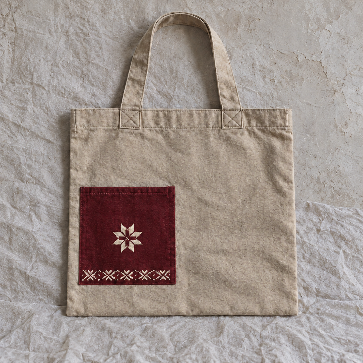 Sand canvas star pocket tote with muted burgundy pocket and centred ivory star