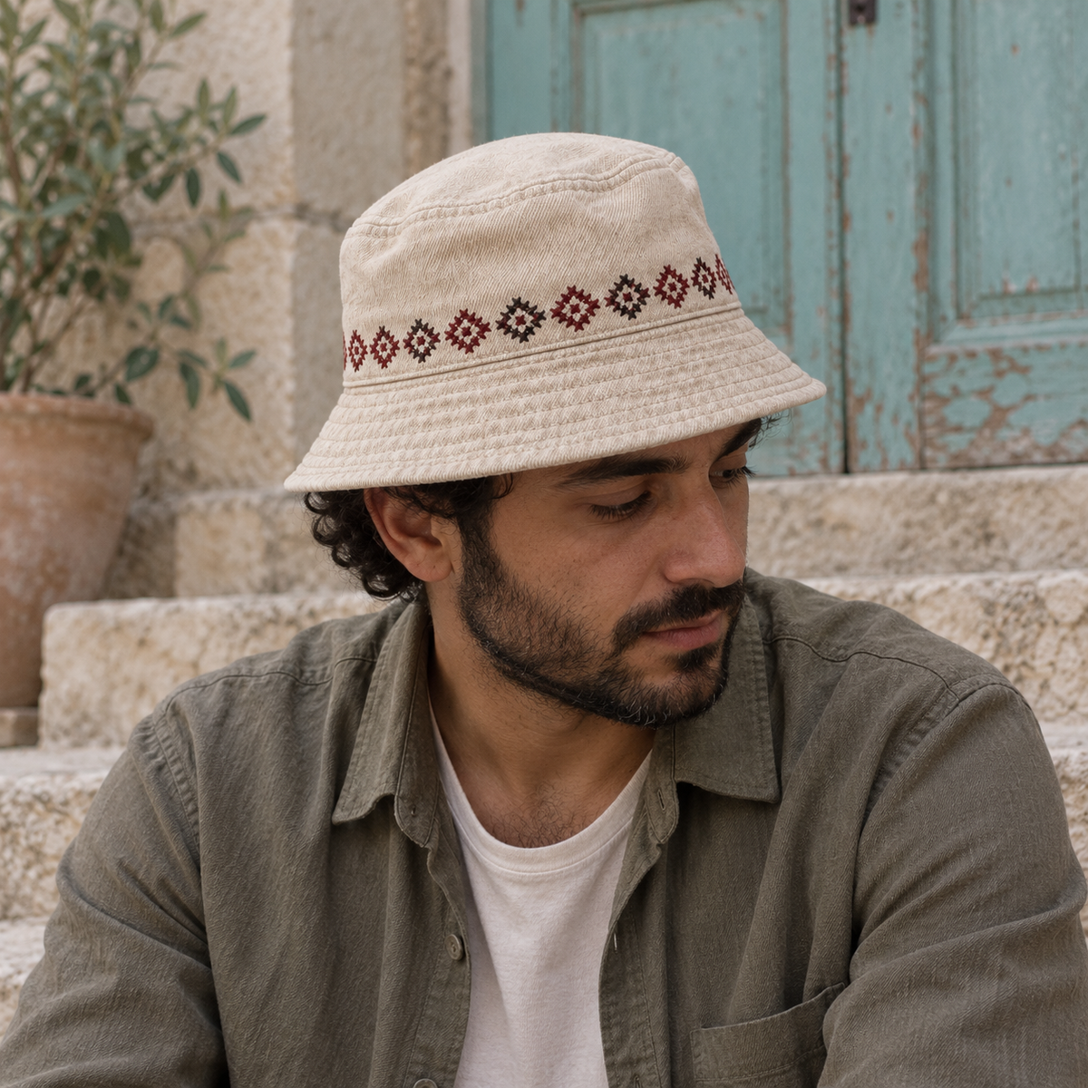 Tatreez Band Bucket Hat - Oatmeal worn on an adult model
