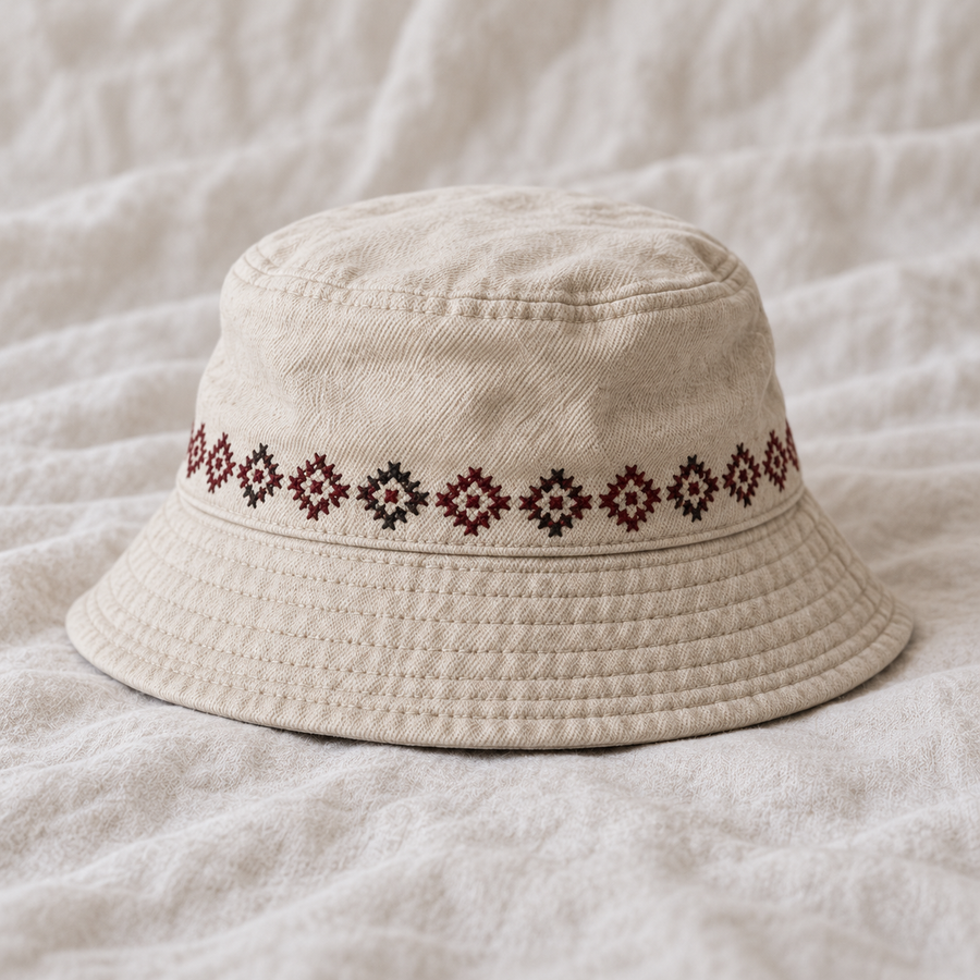 Narrow burgundy charcoal repeating geometric band around crown above brim.