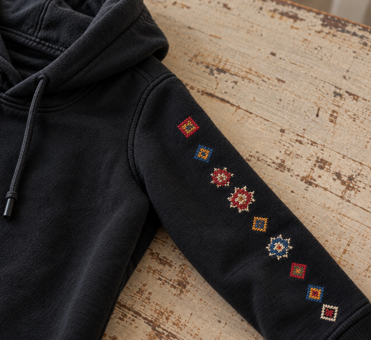 Tatreez Sleeve Line Hoodie - Black - sleeve embroidery close-up
