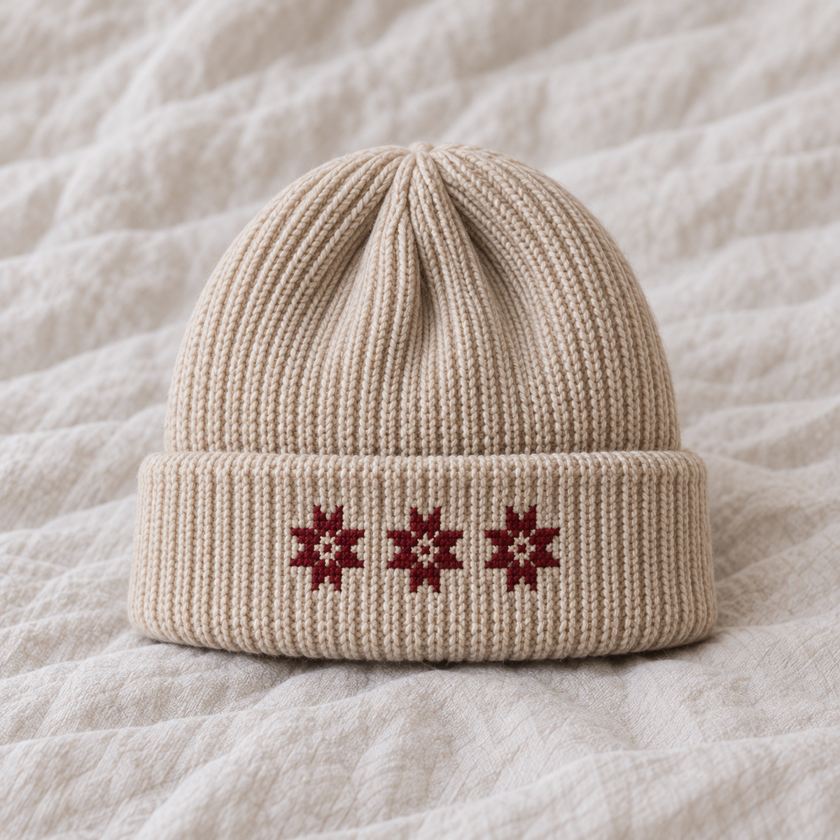 Three small burgundy stars total4.5cm wide directly on cuff, no patch.